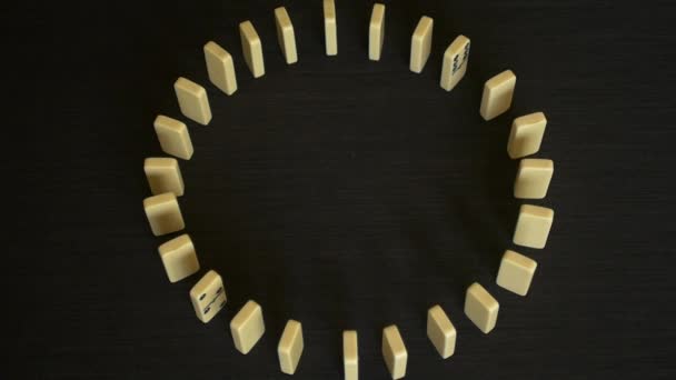 depositphotos_94306154-stock-video-slow-motion-circle-domino-effect